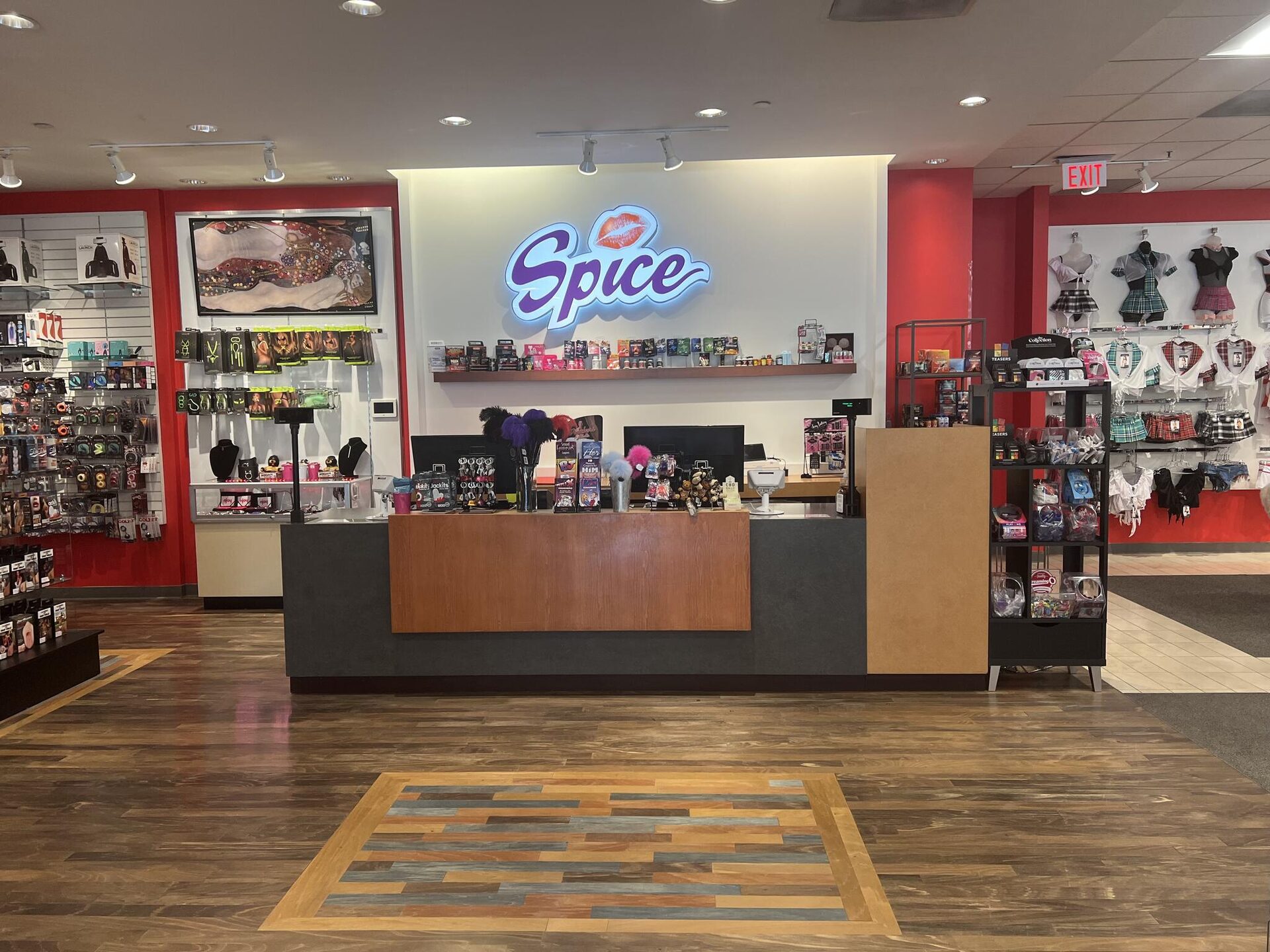The Spice Sensuality boutique in Santa Rosa — illuminated Spice signage above the front counter, curated product displays on either side, polished hardwood floors
